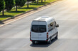 Passenger white minibus accelerating ride on highway