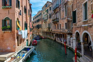 Wall Mural - narrow canal with gondola in venice, italy. architecture and landmark of venice. cozy cityscape of v
