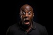 © Jorge Ferreiro - bald african american man with his eyes wide open in extreme surprise