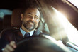 © Davor - Smiling businessman driving car during sunny day