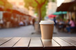 A paper cup with a lid stands on a table in a street cafe. Coffee take away. Coffee cup mockup.