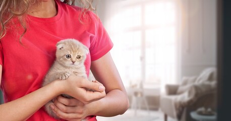 Poster - Happy young woman hugging cat at home