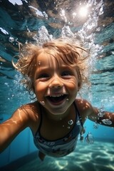 Little Child Swimming Underwater