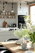 Modern nordic kitchen in loft apartment with spring flowers on the table