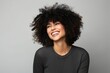 © Igor - happy african american woman with afro hairstyle over grey background
