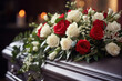 A funeral arrangement with red and white roses, conveying a sense of beauty amidst grief.