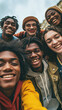 © Lila Patel - Group of Multiracial Young Students Smiling and Taking a Selfie Together, Capturing Joyful Moments of Togetherness. A Happy African American Teenager Laughs with His Cheerful Friends, Embracing the Di