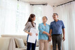 © N_studio - Happy couple elderly looking new home while agent real estate explaining and visit, realtor talking customer about rental housing, banking and mortgage officers, business and insurance concept.