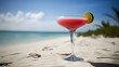 Freshly prepared delicious pink cocktail with a round piece of lime in a Margarita glass on the blurred seashore background