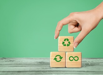 Wall Mural - Green recycle symbol on wooden cubes