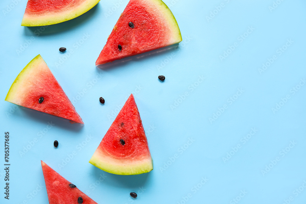Composition with pieces of ripe watermelon on blue background