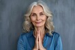 Happy smiling mature 50 years old woman looking at camera feeling sincere gratitude. Portrait of grateful mindful woman prayer hands on chest isolated, Generative AI 