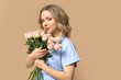 © Pixel-Shot - Pretty young woman with bouquet of beautiful roses on brown background