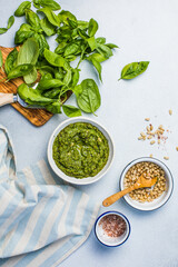 Pesto sauce and ingredients on white background, copy space.Food frame italian food background healthy food concept or ingredients for cooking pesto sauce on a vintage background top view with copy sp