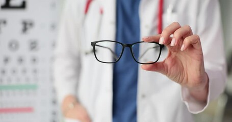 Wall Mural - Glasses on background of vision test table