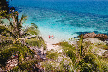 Wall Mural - Drone aerial view at Koh Wai Island Trat Thailand is a tinny tropical Island near Koh Chang. a young couple of men and women on a tropical beach during a luxury vacation in Thailand