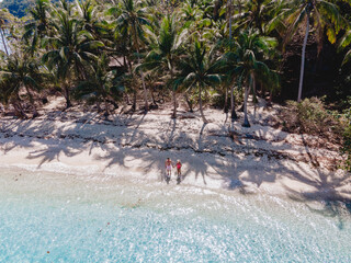 Wall Mural - Drone aerial view at Koh Wai Island Trat Thailand is a tinny tropical Island near Koh Chang. a young couple of men and women on a tropical beach during a luxury vacation in Thailand