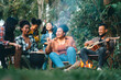 © chokniti - Group of man and woman friends and family singing and playing guitar during having breakfast together. People enjoy and fun outdoor lifestyle travel nature camping on summer holiday vacation.