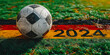 Soccer ball on a green field with UEFA Euro 2024 text, symbolizing the anticipation for the upcoming European football championship