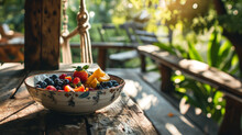 A Bowl Of Healthy Fruits On A Rustic Table, In A Sunny Garden Setting.