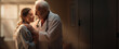 A male doctor tenderly embraces a young patient against the background of a cozy room with warm light in an intimate setting. Intergenerational relationship. Elderly care. Ultra wide banner.Copy space