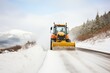 snow plow clearing a rural mountain way