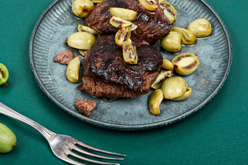 Wall Mural - Grilled ostrich steak with kiwi berries