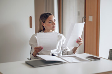 Wall Mural - Cute blonde young wo,an working with documents