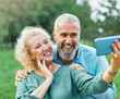 © Lumos sp - woman man outdoor mature couple selfie together camera photo phone smartphone mobile mid adult cell smiling love old lifestyle wife happiness middle aged nature active vitality