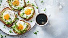 Avocado Egg Sandwiches And Coffee For Healthy Breakfast. Whole Grain Toasts With Mashed Avocado, Fried Eggs And Organic Microgreens On White Table. 