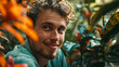 © Keitma - Cinematic closeup portrait of a young Nordic man, looking into camera with happy smiling face , in a jungle like garden filled with exotic plants in vibrant colours