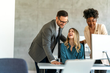 Sticker - Group of multiethnic business people analyzing data using computer while working in the office