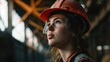 © Fotograf - A woman wearing a hard hat and safety glasses. Suitable for construction and industrial themes