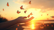 human hands releasing group of butterflies over sunset, Hope freedom concept
