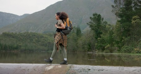 Wall Mural - nature, backpack and young woman hiking in forest on vacation, adventure or weekend trip. travel, wa