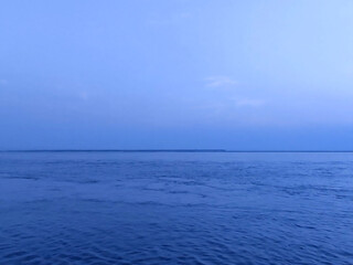 beautiful blue river, calm water, and sky photo background.