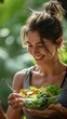 © Oleksandr Kozak - Attractive and joyful young female prepared fresh food salad