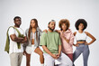 © LIGHTFIELD STUDIOS - group of positive young african american friends posing together on grey background, community