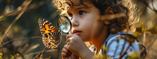 Smiling Child Looking At Butterfly Through Magnifying Glass.nature