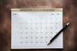 This visually striking paper calendar features days that have been scratched out or crossed out with a black marker, symbolizing unavailability or invalidity