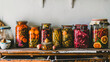 Fall seasonal pickled or fermented vegetables in cans lined up above vintage kitchen.
