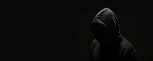 Veiled In Shadows. Mysterious Figure Shrouded In Darkness Wearing Hood And Faceless Mask Emanating Aura Of Menace And Intrigue Perfect For Capturing Essence Of Mystery And Suspense