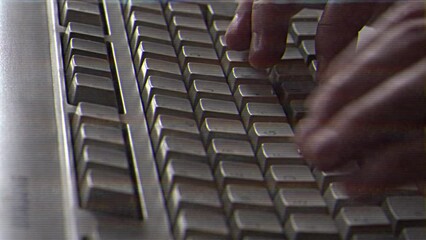 Wall Mural - computer engineer developer is working on old vintage computer 1990s. antique classic pc keyboard an