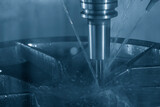 The CNC milling machine cutting  the aluminum alloy wheel part with liquid coolant method.
