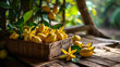 delicious carambola fruit in a wooden box on the background of nature.