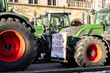 Farmers union protest strike against government Policy in Germany Europe. Tractors vehicles blocks city road traffic. Agriculture farm machines Magdeburg central Breiter weg street