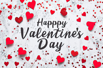gray background with hearts with the words Happy Valentine's Day