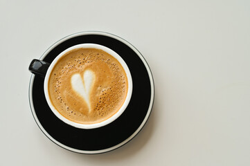 Wall Mural - A cup of heart-shaped latte coffee