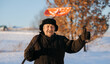 © Parilov - Elderly man cleaning snow with shovel in village after snowstorm, pensioner works as janitor