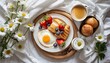 continental breakfast on white bed sheets flat lay